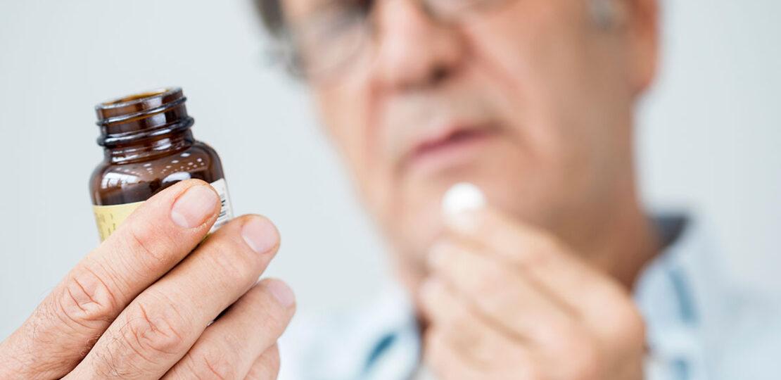 Senior Man Taking Supplement Optimized